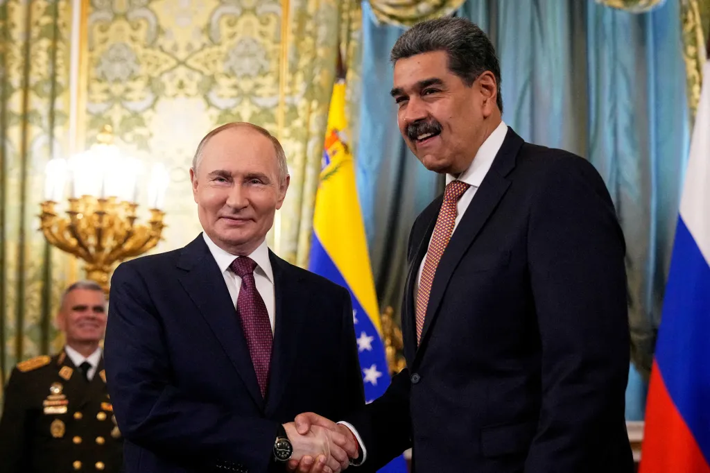Russian President Vladimir Putin shaking hands with Venezuelan President Nicolas Maduro.