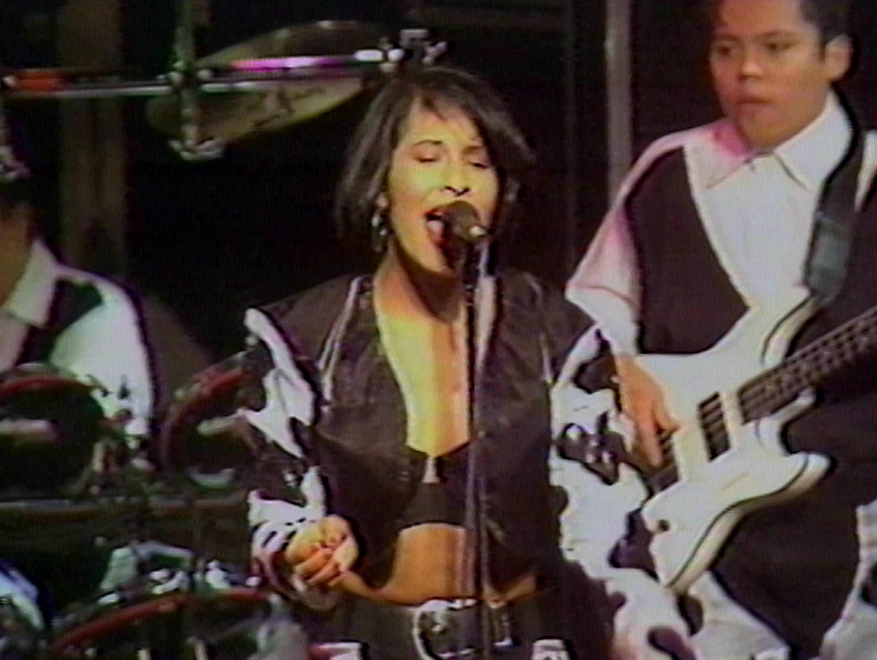 Legendary Latina singer Selena decked out in a cow print costume on stage in home video shown in the Netflix documentary 'Selena y Los Dinos'