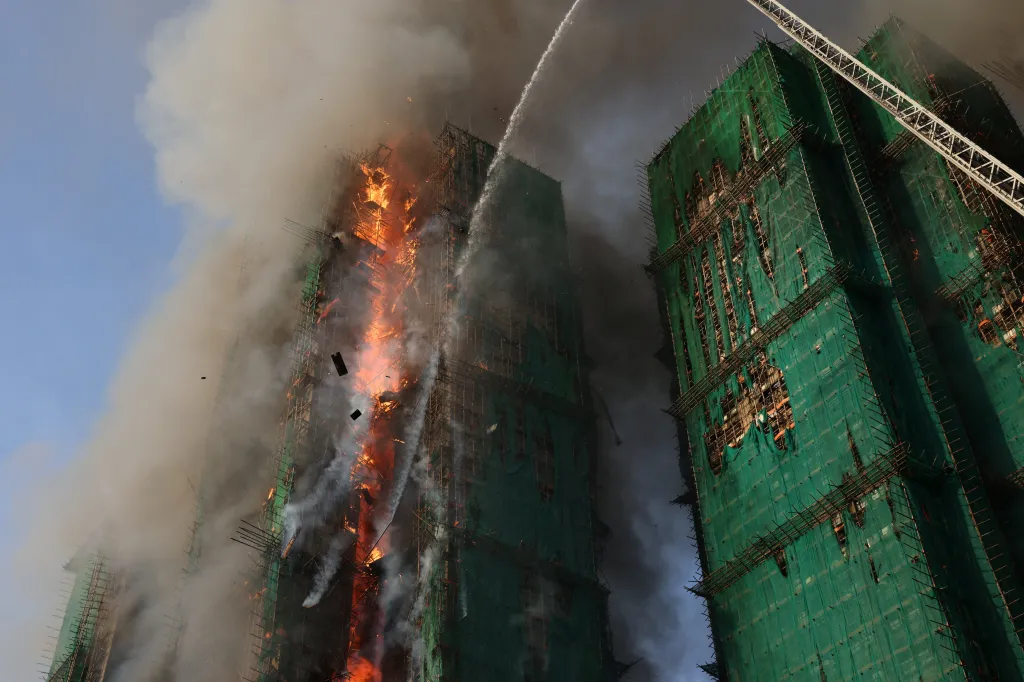 Firefighters battle the blaze at one of the buildings on-fire on Nov. 26, 2025.