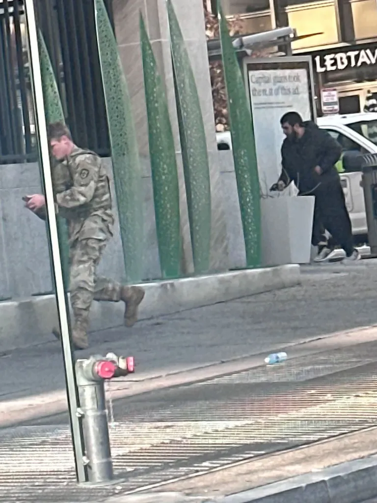 Rahmanullah Lakanwal, a suspect, attacks a National Guard soldier.