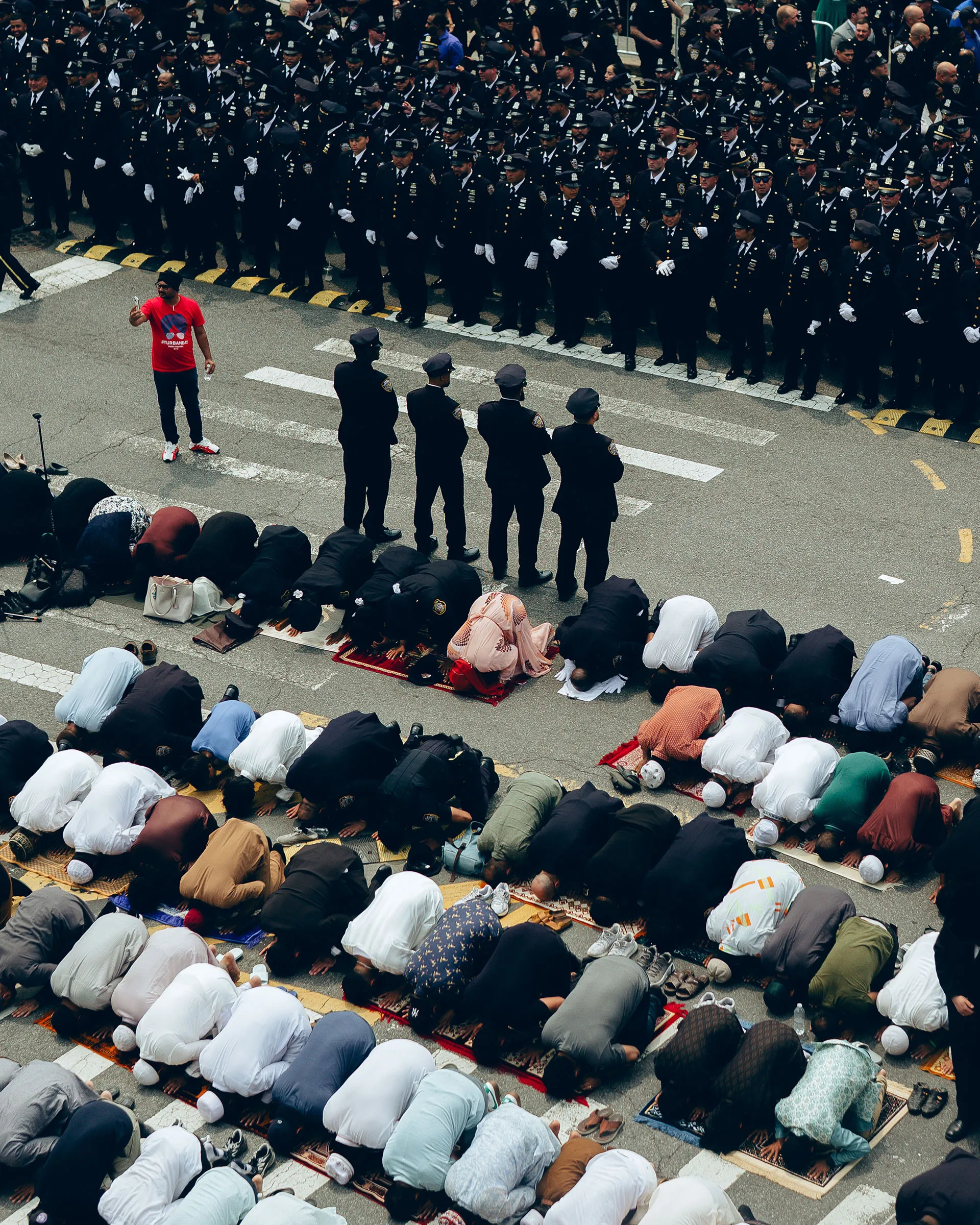 People gather for prayer outside the Parkchester Jame Masjid during the funeral for NYPD Officer Didarul Islam in the Bronx, on Thursday, July 31, 2025.