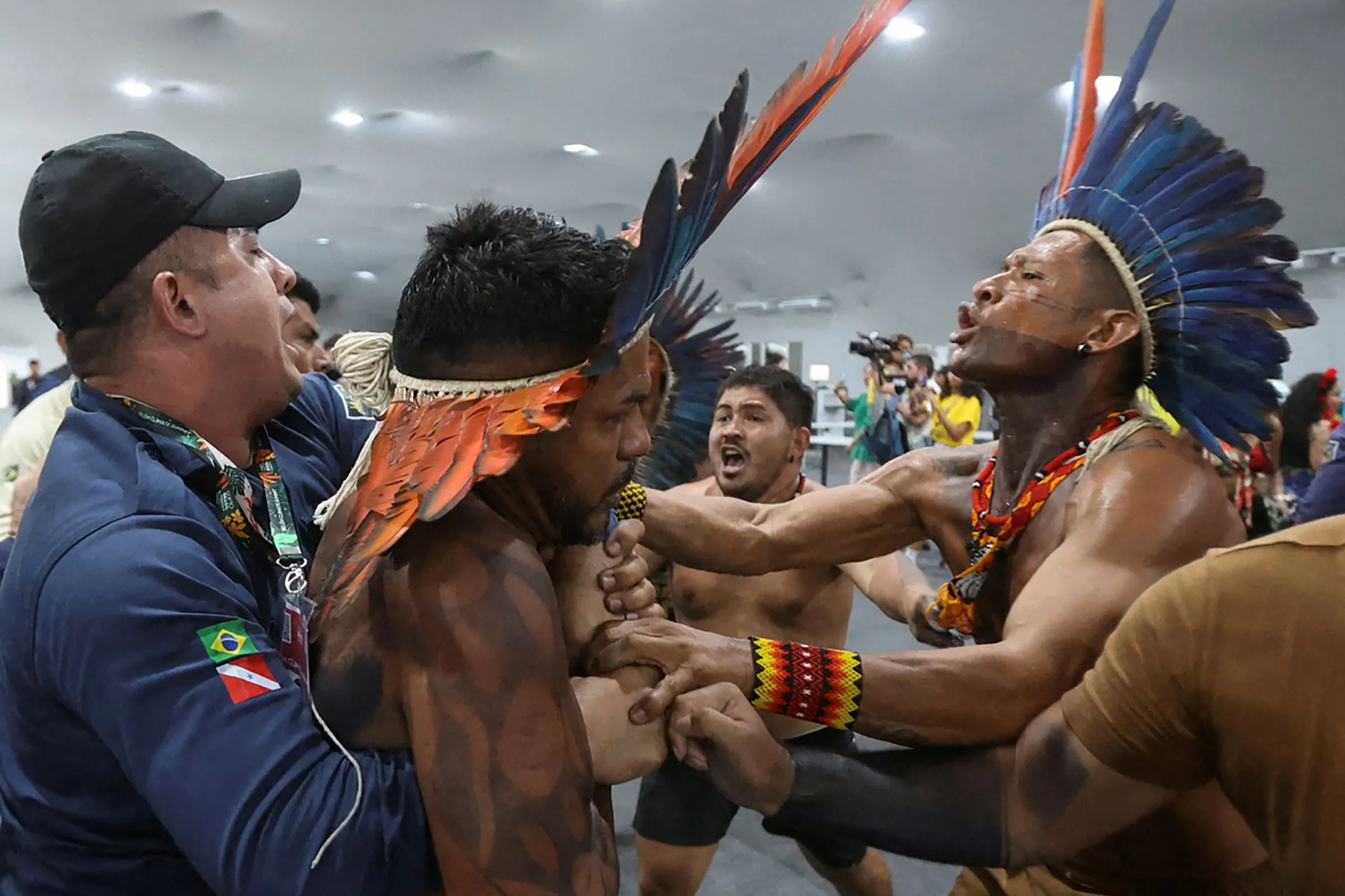 Demonstrators force their way into the venue hosting the UN Climate Change Conference (COP30), in Belem