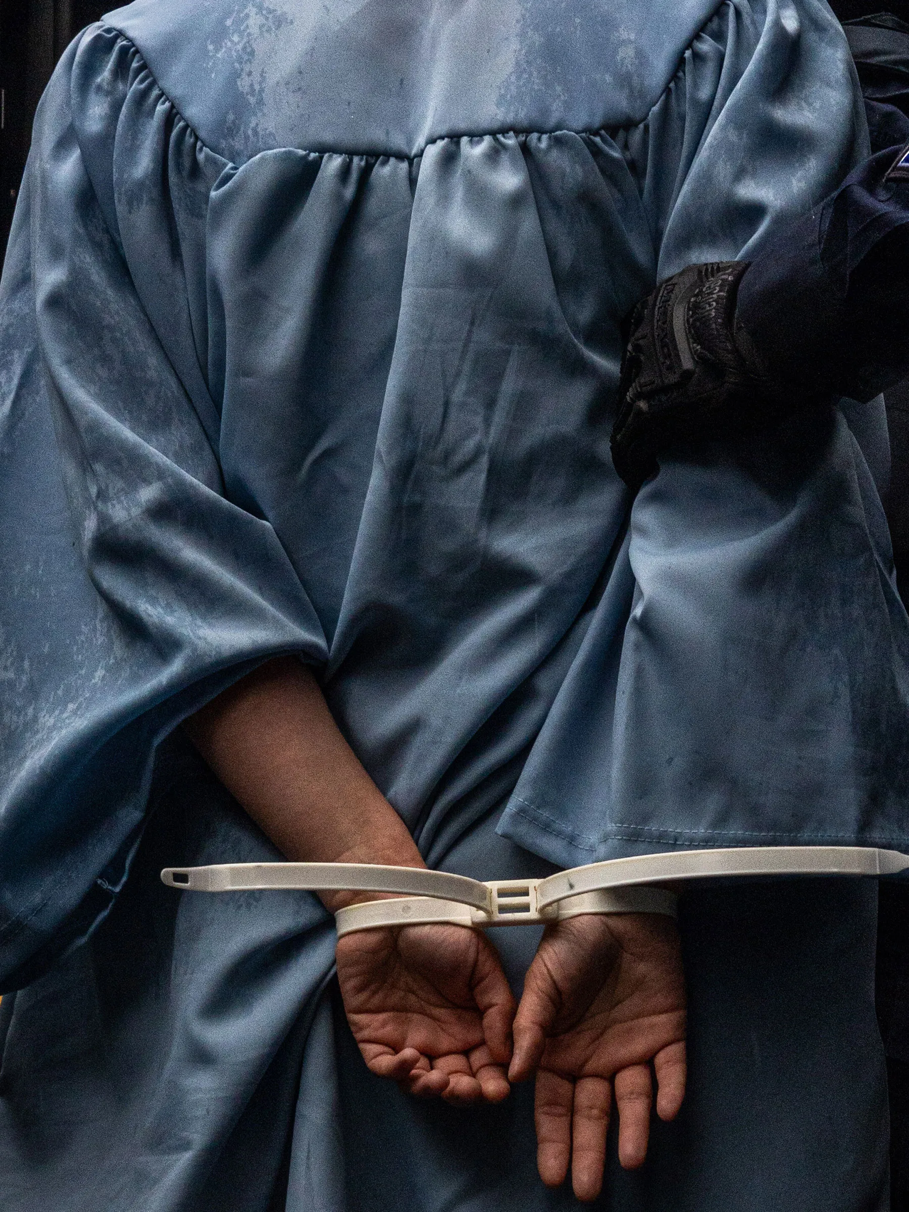 Columbia University alumni Jess Pearce is arrested during a protest of Columbia University outside the campus during their graduation ceremony in New York City, on May 21.