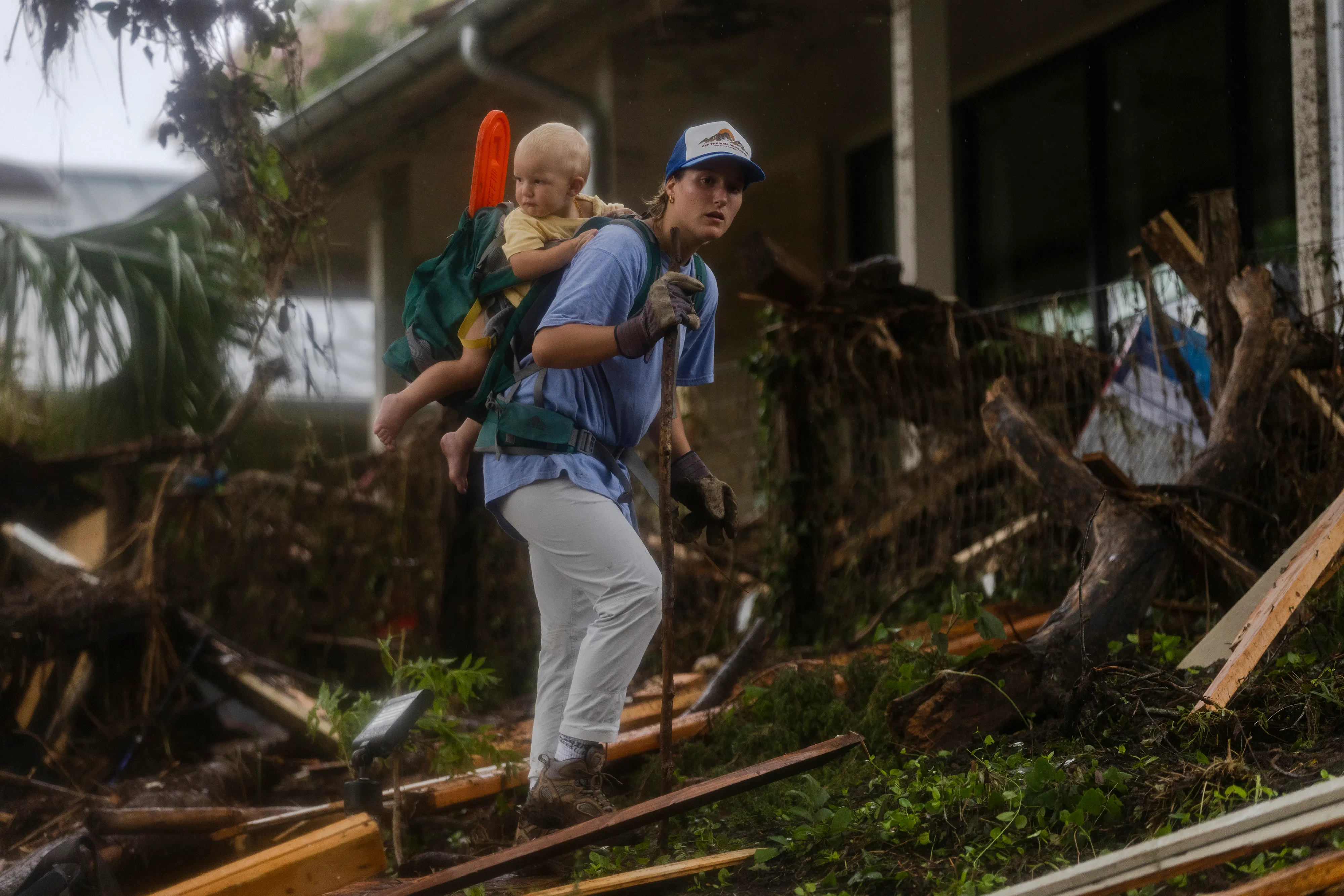 A search and rescue worker looks through debris for any survivors or remains of people swept up in the flash flooding in Hunt, Texas, on July 6.