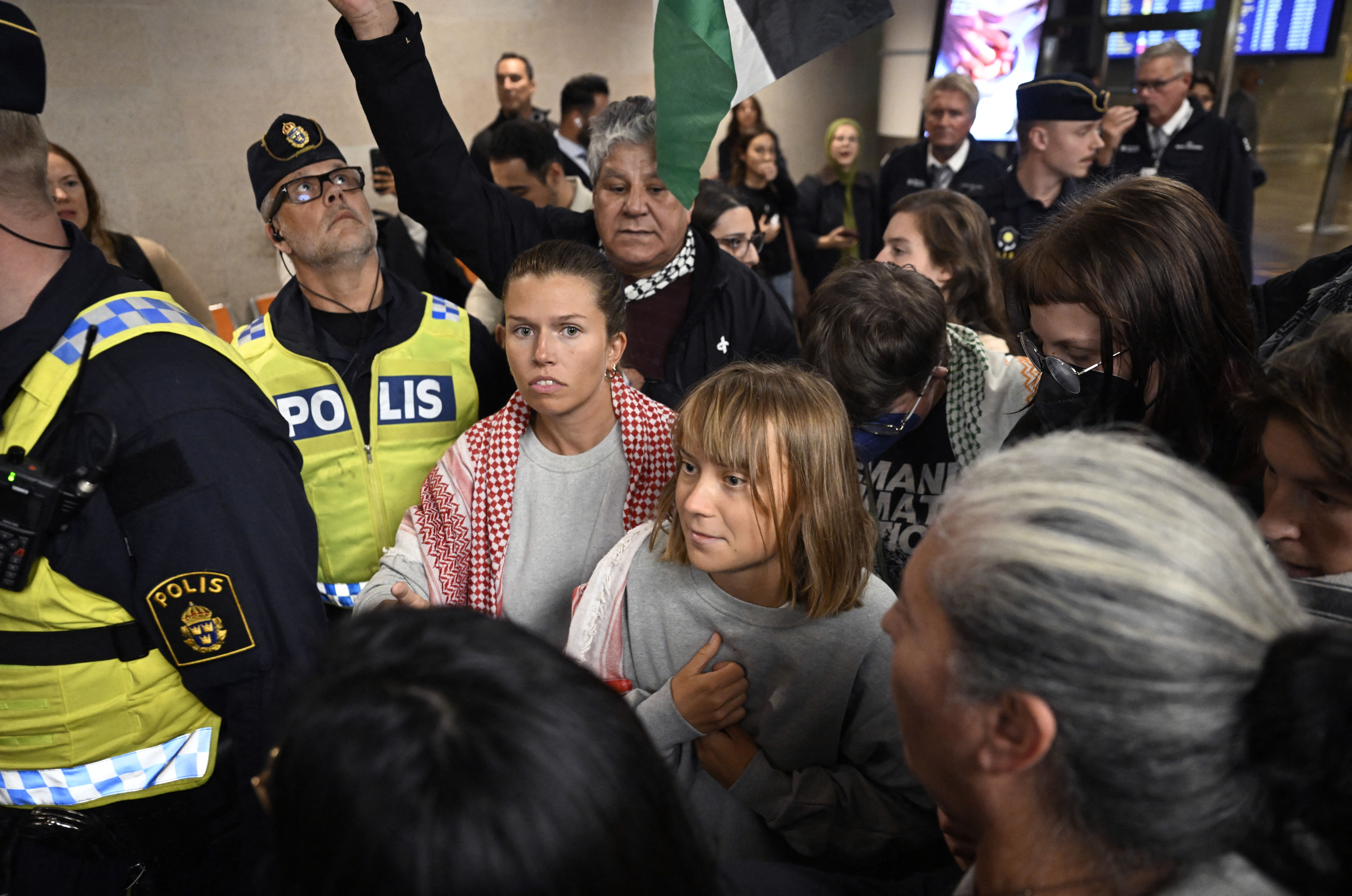 Swedish activist Greta Thunberg and other participants of the Global Sumud Flotilla arrive at Arlanda Airport, in Stockholm, Sweden on Oct. 7, as they return from detention in Israel for taking part in the aid flotilla bound for Gaza.