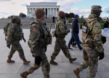 U.S. halts all asylum decisions after shooting of National Guard members