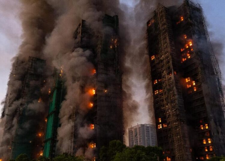 13 people killed in fire engulfing Hong Kong high-rise residential buildings, fire services say