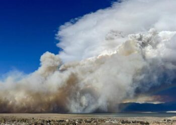 A wildfire and a rainbow: Dramatic photo shows California fire as storm rolls into region