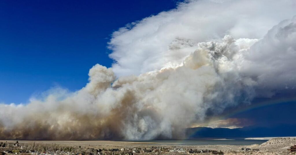 A wildfire and a rainbow: Dramatic photo shows California fire as storm rolls into region