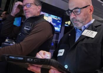 Wall Street swings through another erratic day ahead of a couple of crucial tests