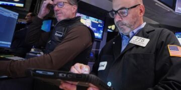 Wall Street swings through another erratic day ahead of a couple of crucial tests