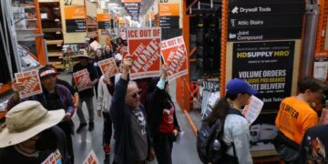 Day laborer organizers protest Home Depot, pressuring it to “scrape ICE out of their stores.”