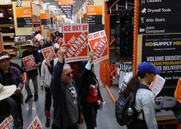 Day laborer organizers protest Home Depot, pressuring it to “scrape ICE out of their stores.”