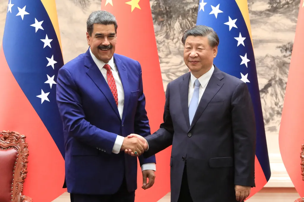 Venezuela's President Nicolas Maduro shakes hands with China's President Xi Jinping.