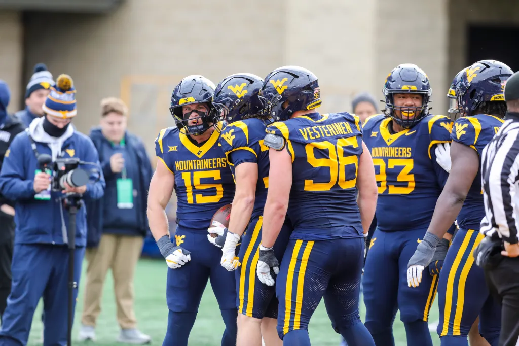 West Virginia University football players celebrate an interception during the second quarter against Texas Tech on Nov. 29, 2025.