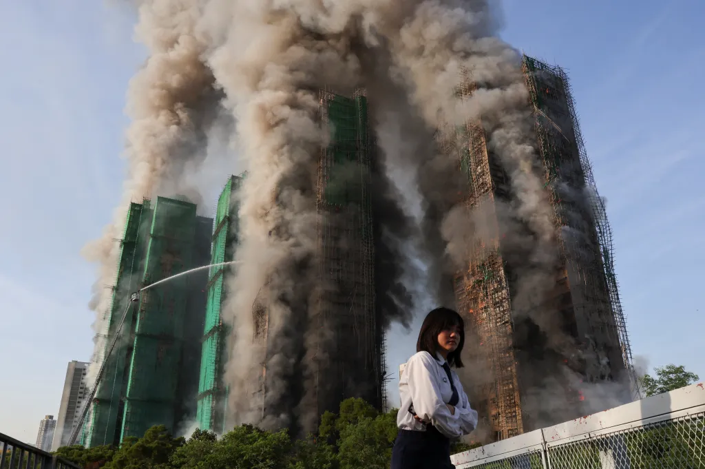 Smoke engulfs the bamboo scaffolding of the residential buildings complex at Wang Fuk Court on Nov. 26, 2025.