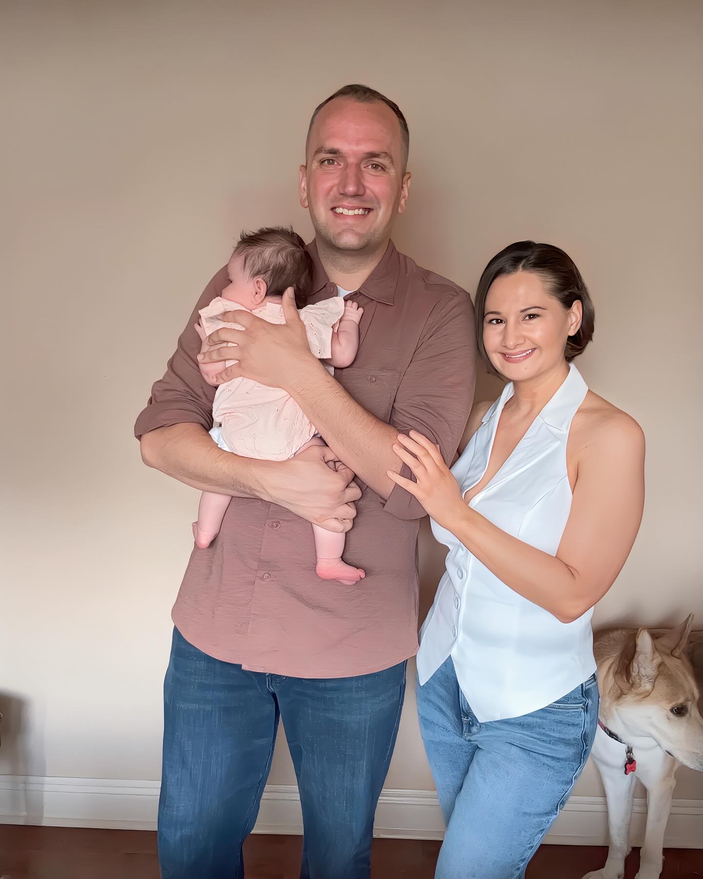 Gypsy Rose Blanchard and Ken Urker posing for a family photo with their daughter.