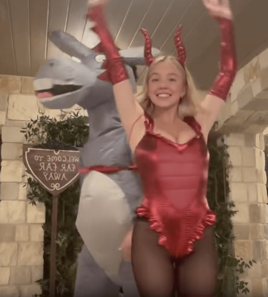 Sydney Sweeney in a red dragon costume with a person in a donkey costume from Shrek.