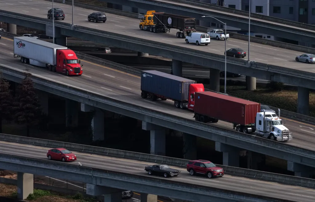 Trucks drive on Interstate 80 in Albany, California, on Nov. 14, 2025.