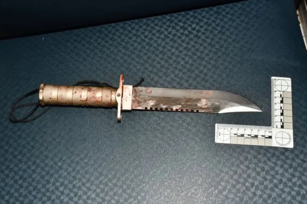 A bloody knife found on the train, next to a ruler, used as evidence in the death of Dante Dwaine Day.