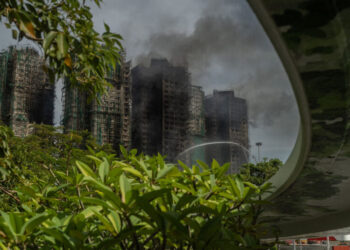 After Deadly Fire, Hong Kong Ominously Warns Grieving Citizens to Stay in Line