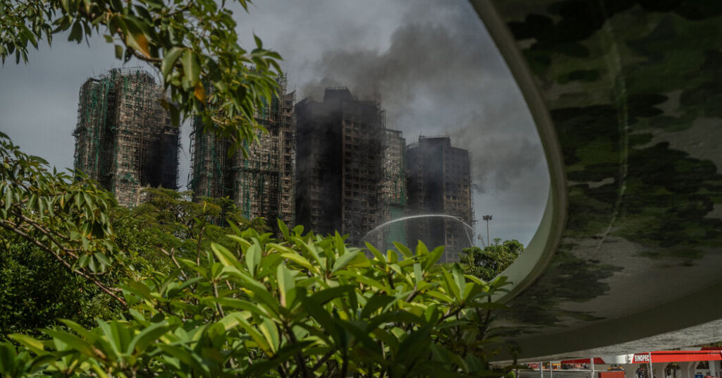After Deadly Fire, Hong Kong Ominously Warns Grieving Citizens to Stay in Line