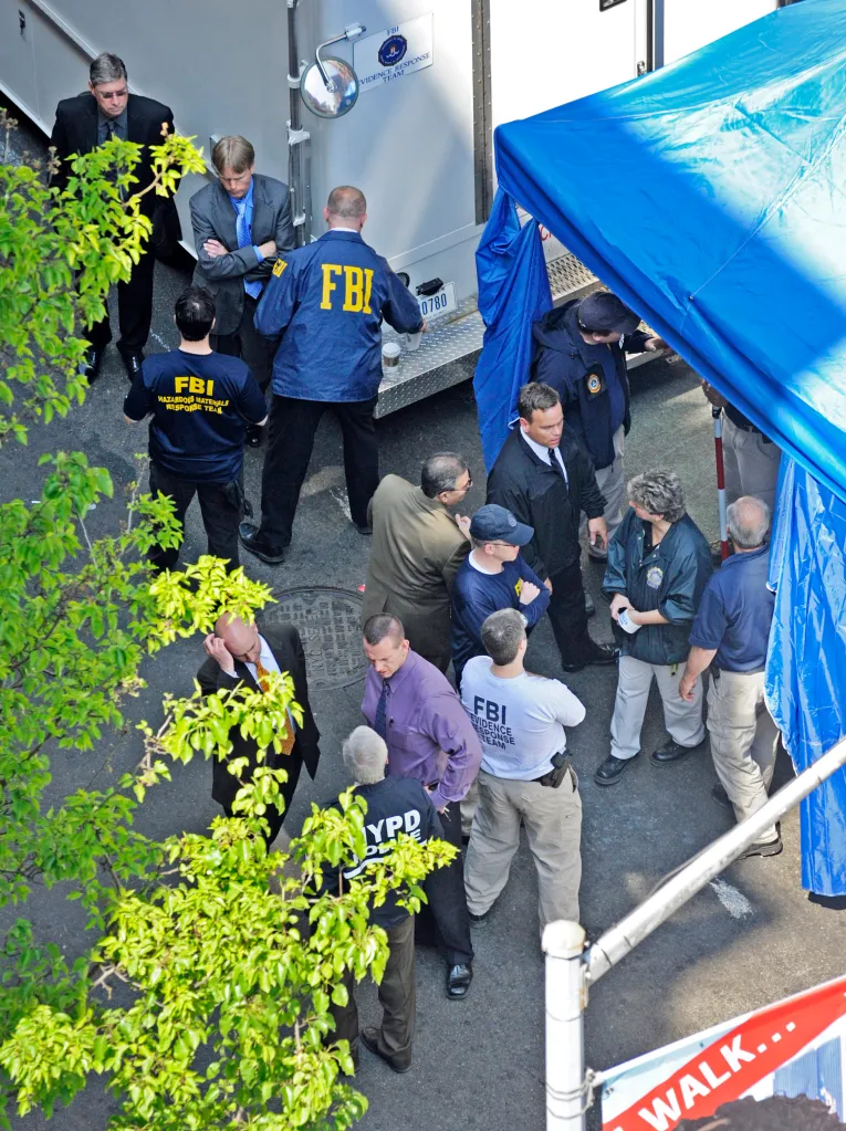 FBI agents and NYPD officers search a building basement in SoHo for evidence related to the missing child, Etan Patz.