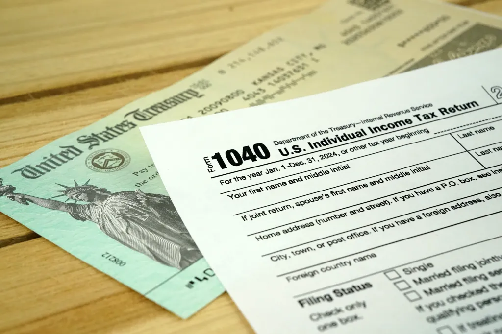 A 2024 United States Individual 1040 tax form and a U.S. Treasury check.