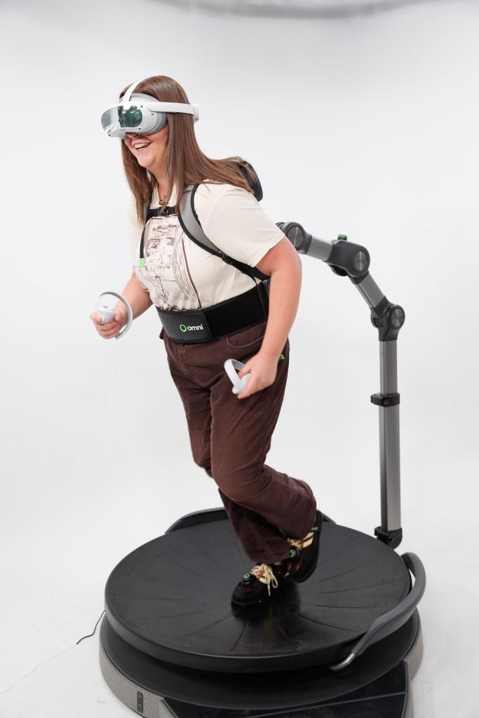 McKinzie Beard testing the Omni One virtual reality system.