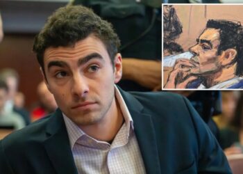 Luigi Mangione appears to nervously bite nails when cops bring up what was on him when he was busted