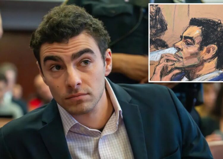 Luigi Mangione appears to nervously bite nails when cops bring up what was on him when he was busted