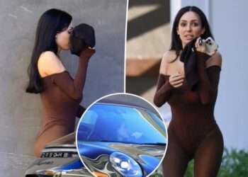 Bianca Censori covers face with spandex shorts before getting parking ticket