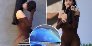 Bianca Censori covers face with spandex shorts before getting parking ticket