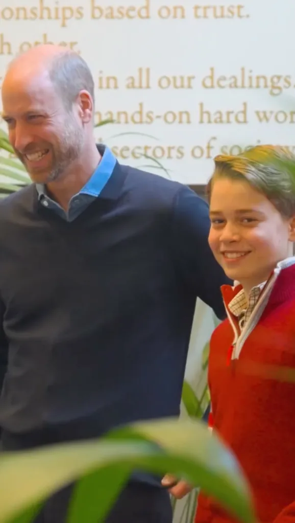 Prince William and Prince George smile together.