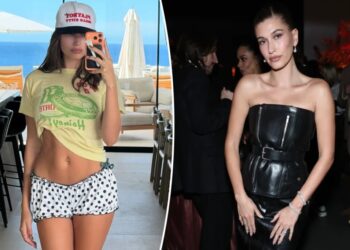 Hailey Bieber displays taut midriff in tiny polka-dot shorts for beachside selfie