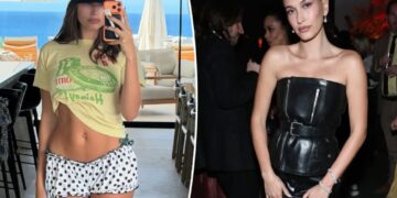 Hailey Bieber displays taut midriff in tiny polka-dot shorts for beachside selfie