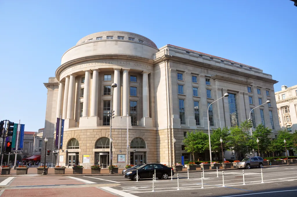 The Ronald Reagan Building in Washington D.C., a large stone structure with a curved, columned facade.