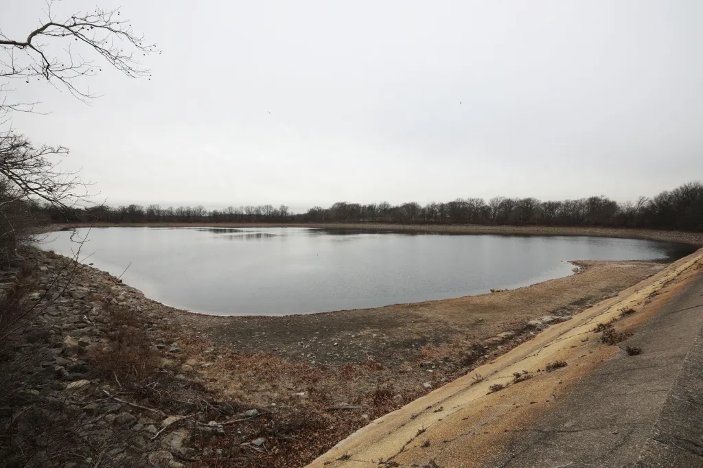 Showing the Silver Lake at the Silver Lake Park, with the mid-lane Pedestrian Bridge on the right, showing where the Water level used to be, at Forest Avenue in Staten Island, NY. 