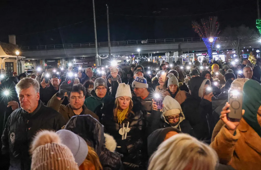 Residents of Lindenhurst, NY, gathered at a gazebo for a candle lighting ceremony for Edeedson Cine.