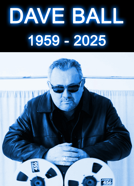 Dave Ball, 1959-2025, shown in a blue-tinted photo, wearing sunglasses and a leather jacket, with hands resting on two audio tape reels.