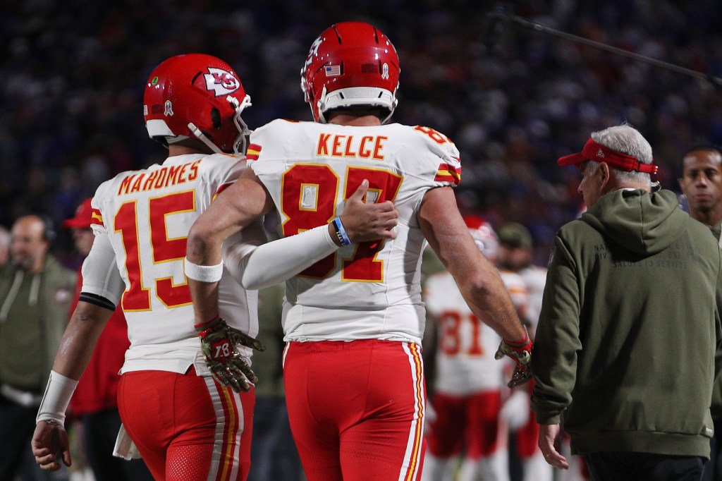 Patrick Mahomes and Travis Kelce walk off the field together at Highmark Stadium.