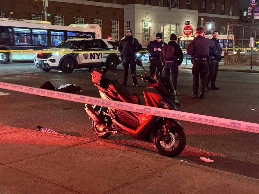 Crime scene at 168th St and 93rd Ave in Queens, with an NYPD vehicle, a scooter, police tape, and officers.