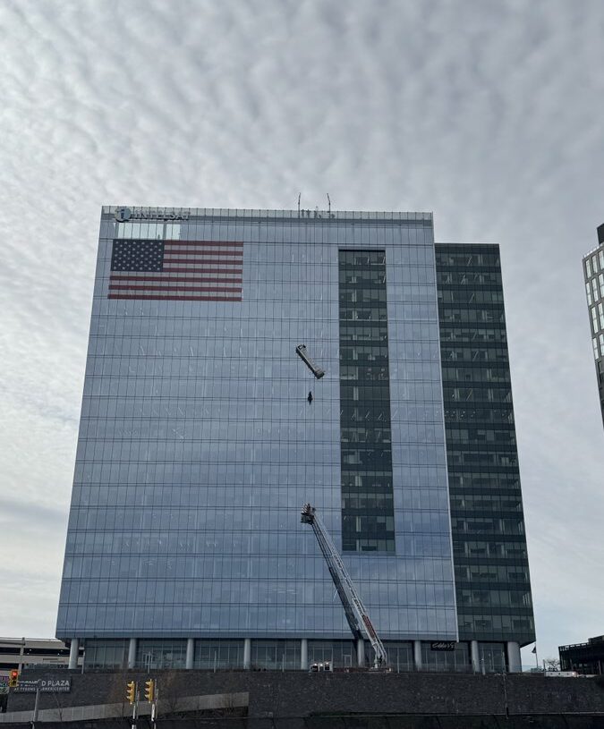 Workers rescued after dangling from window-washing platform