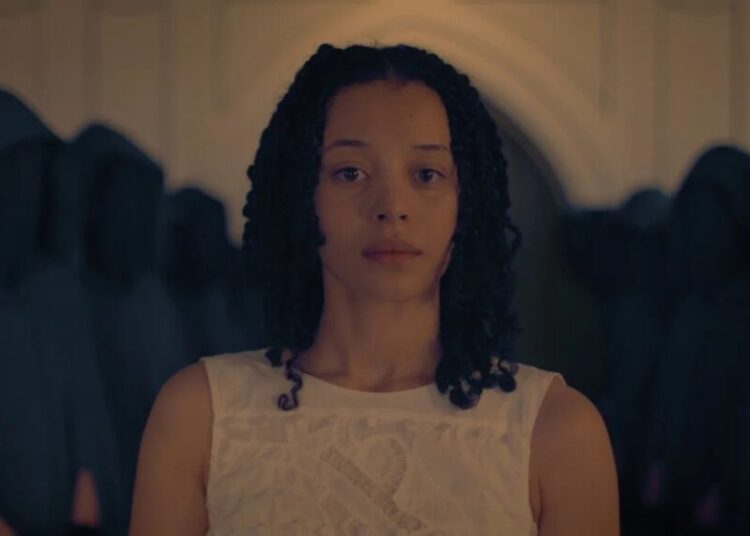 Chase Infiniti Suits Up in First Look at ‘Handmaid’s Tale’ Spinoff ‘The Testaments’ | Photos