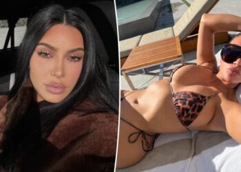 Kim Kardashian soaks up the sun in a tiny leopard print string bikini