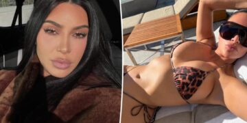 Kim Kardashian soaks up the sun in a tiny leopard print string bikini