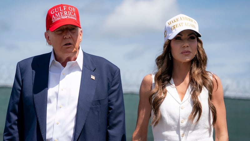 President Donald Trump and Department of Homeland Security Secretary Kristi Noem