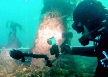 Divers Intrigued by Huge Underwater Structure