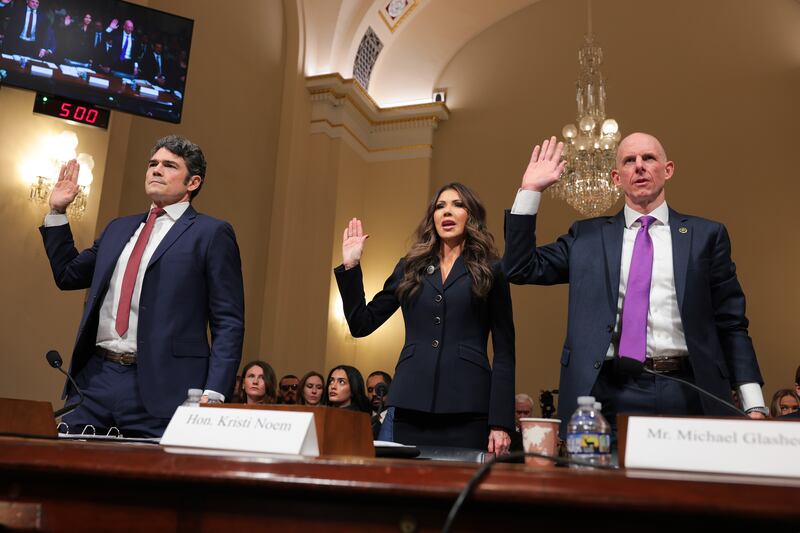 Director of the National Counterterrorism Center Joseph Kent, Secretary of Homeland Security Kristi Noem, and Operations Director of the National Security Branch at the FBI Michael Glasheen are sworn-in prior to testifying before the House Homeland Security Committee on December 11, 2025.