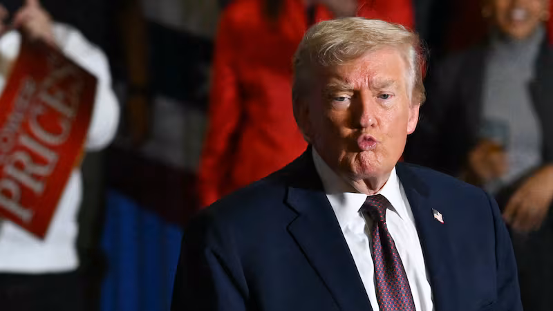 US President Donald Trump gestures to the crowd after speaking at a political rally in Rocky Mount, North Carolina on December 19, 2025. (Photo by ANDREW CABALLERO-REYNOLDS / AFP via Getty Images)